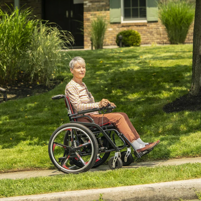 ElderlyPersonOnModelHHybridManualPowerChair
