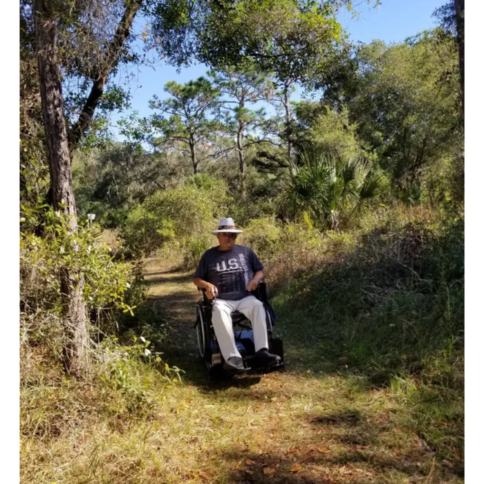 Freedom Trax Wheelchair Pro On Outdoor Grass Trail