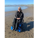 Person Enjoying Freedom Trax  FT1 Wheelchair Attacment On Wet Beach