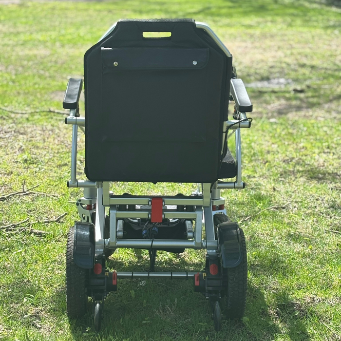 Zeus Power Wheelchair Back View On Grass