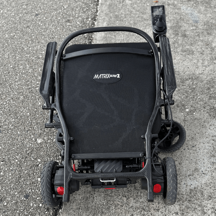 Matrix Ultra 2 Wheelchair Folded Up On Pavement