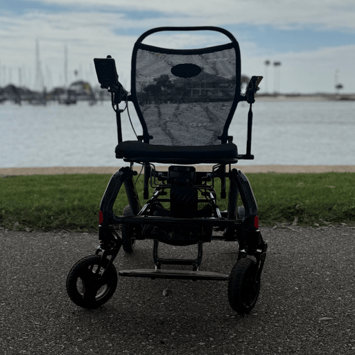 Matrix Ultra 2 Wheelchair on a paved path with water and sky in the background