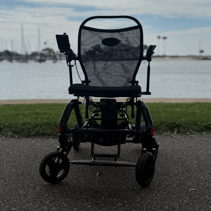 Matrix Ultra 2 Wheelchair on a paved path with water and sky in the background