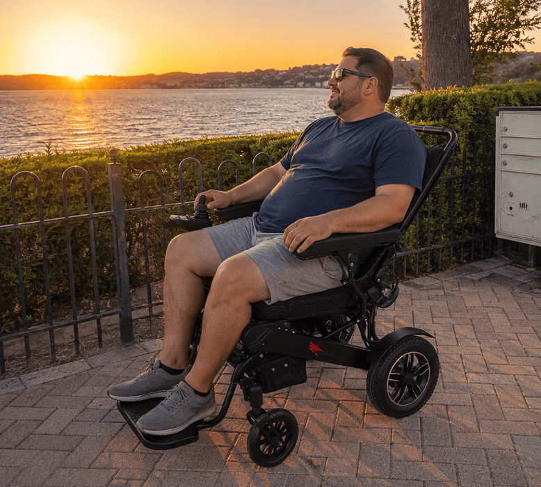 Man Reclined On The Sky Hawk Electric Wheelchair