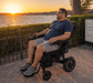 Man Reclined On The Sky Hawk Electric Wheelchair
