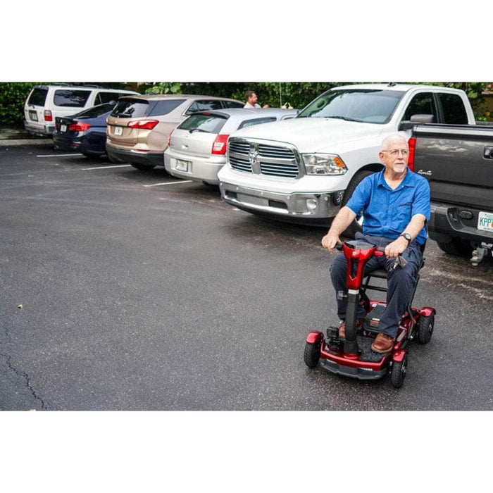 EV Rider Teqno Folding Mobility Color Red Driving with the Old Man at the Parking Lot