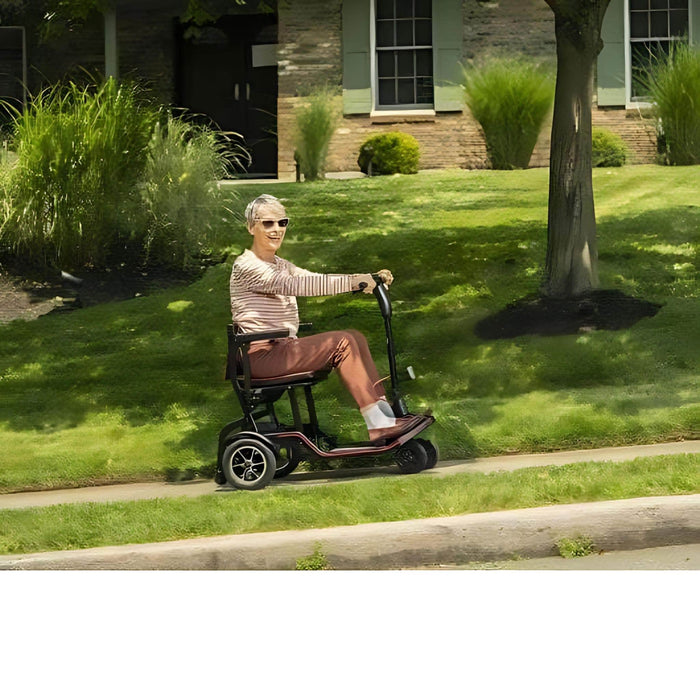 FeatherWeight Mobility Scooter Driving an Older Woman