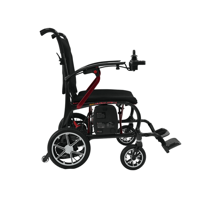 The Forcemech Ultralite G10 Carbon Fiber Powerchair, weighing just 26 lbs, features a black and red design with an ultralight frame, joystick control on the armrest, large rear wheels, smaller front wheels, a cushioned seat, and adjustable footrests for enhanced mobility and convenience.