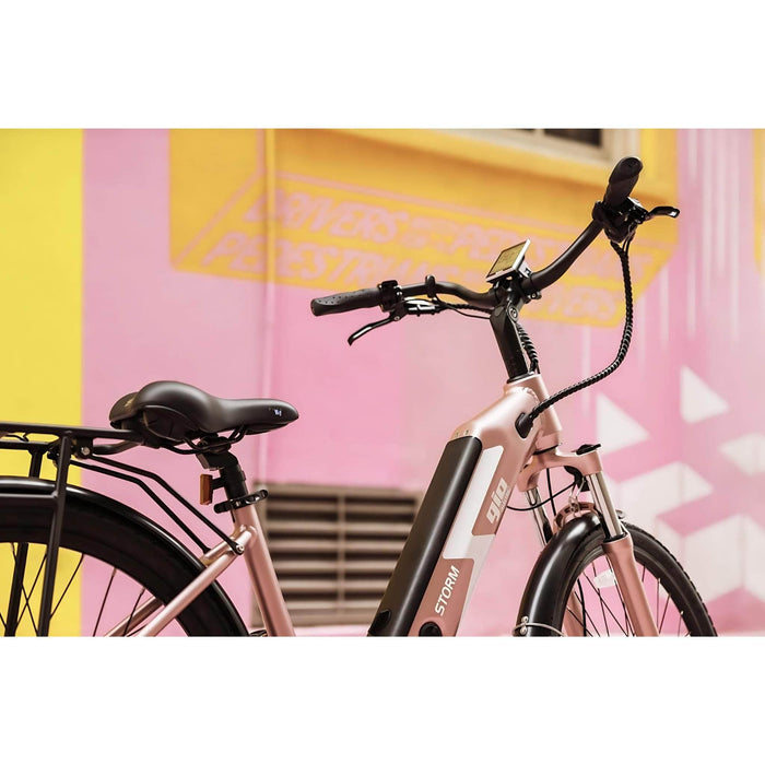 GIO Storm Electric Bike in Rose Gold with Background Picture 3