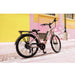 GIO Storm Electric Bike in Rose Gold with Background Rear Right Side View