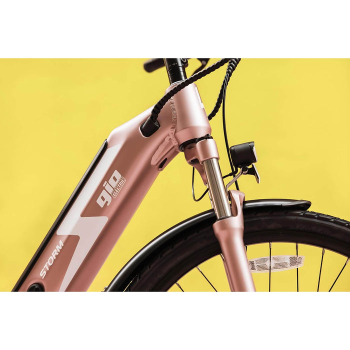 GIO Storm Electric Bike in Rose Gold with Background Close