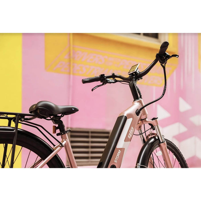 GIO Storm Electric Bike in Rose Gold with Background Picture 2