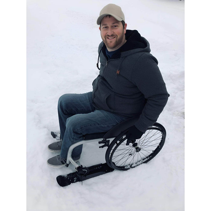 Slick Skis Caster Attachment Man using Wheelchair with Slick Skis