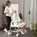 CleanHeightAdjustableShowerCommodeCaregiverAssistingElderlyPerson