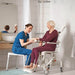 SwiftMobil-2ShowerCommodeChairCaregiverAssistingElderlyPerson