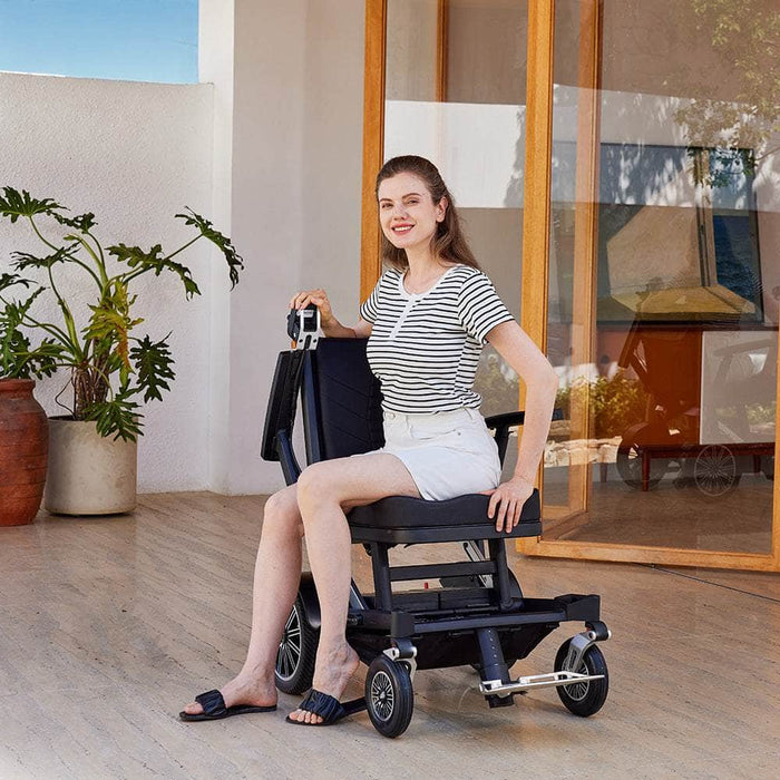 OAS Adventure Pro All-Terrain Electric Wheelchair with rider at home
