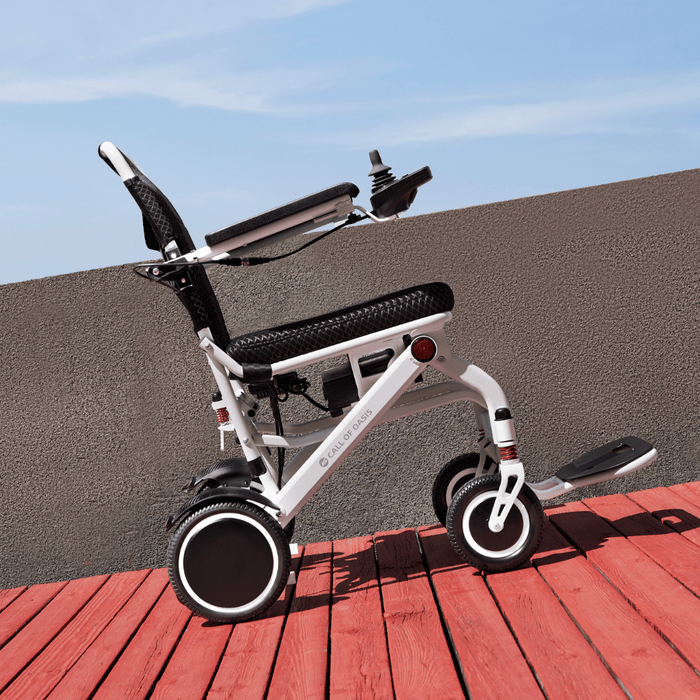 OAS Air Pro Electric Wheelchair on a wooden deck outdoors
