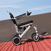 OAS Air Pro Electric Wheelchair on a wooden deck outdoors