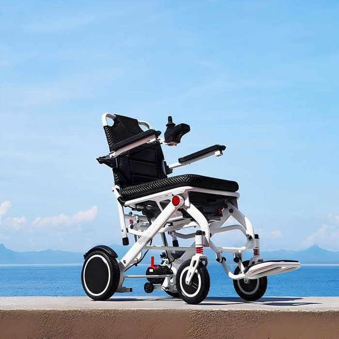 OAS Air Pro Electric Wheelchair on a seaside promenade