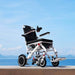 OAS Air Pro Electric Wheelchair on a seaside promenade