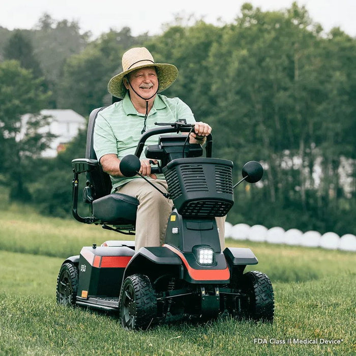 Pride PX4 4-Wheel Scooter man driving on grass