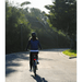 Woman_Facing_Back_Riding_Simple_Step-Thru_500W_at_the_Road